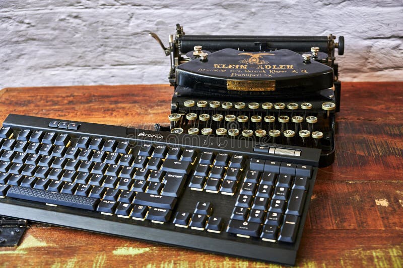 Historic Typewriter and Modern Keyboard that Show the Progress of the