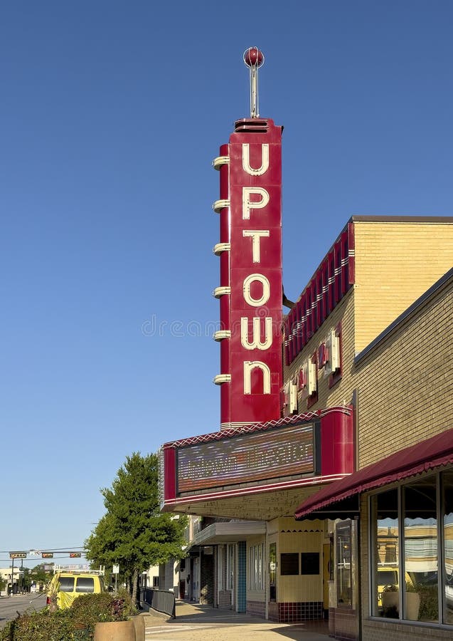 The historic Uptown Theater on Main Street in downtown Grand Prairie, Texas, on a bright sunny day.