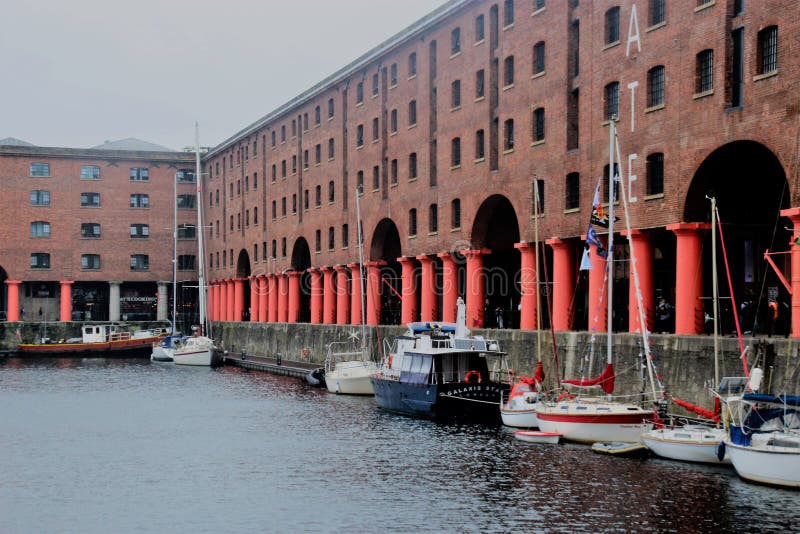 Liverpool, England – July 27, 2019: Historic brickstone warehouses, part of the Royal Albert Dock in Liverpool, England, Europe. The docks are a Unesco world heritage site. Liverpool, England – July 27, 2019: Historic brickstone warehouses, part of the Royal Albert Dock in Liverpool, England, Europe. The docks are a Unesco world heritage site.