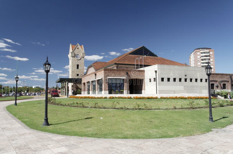 The historical train station with a clock tower and iron street light poles in Tigre, Buenos Aires province, Argentina. The historical train station with a clock tower and iron street light poles in Tigre, Buenos Aires province, Argentina.