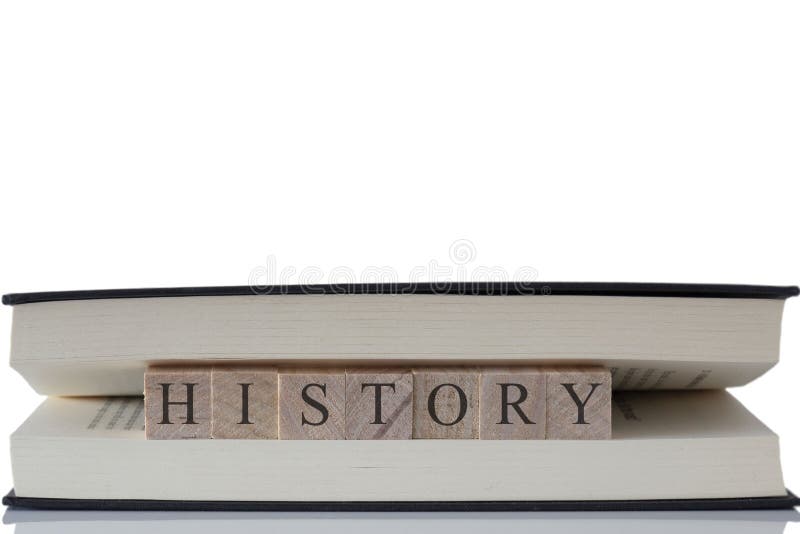 History Written On Wooden Blocks Inside A Book Isolated On A White