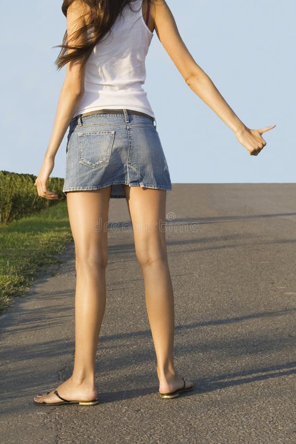 Hitchhiking girl on the street