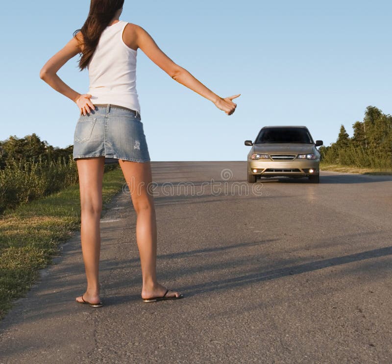 Hitchhiking girl on the street