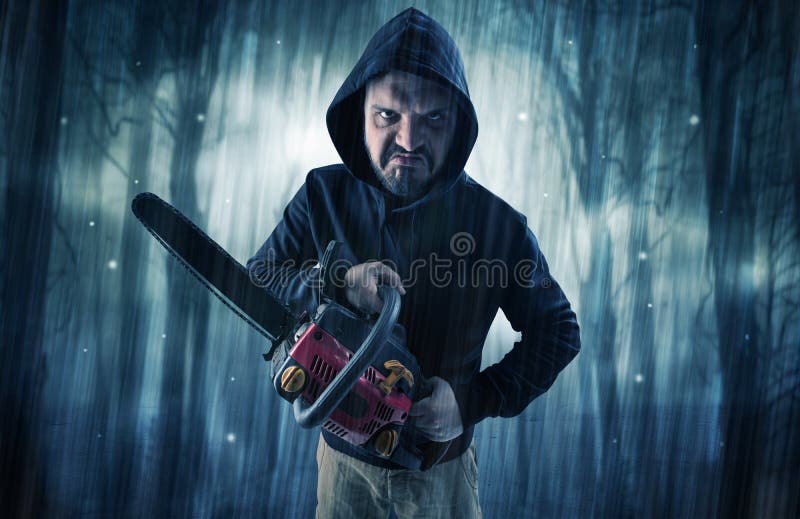 Masked armed hitman in dark thick forest with foggy mysterious concept. Masked armed hitman in dark thick forest with foggy mysterious concept