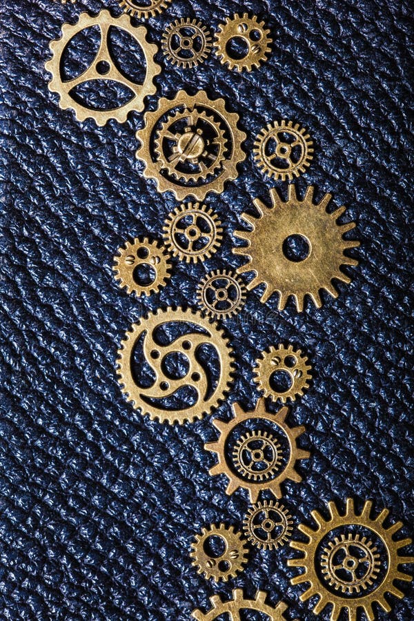 Hjul för Steampunk mekaniska kuggekugghjul på läderbakgrund royaltyfria foton Hjul för Steampunk mekaniska kuggekugghjul på läderbakgrund royaltyfria foton