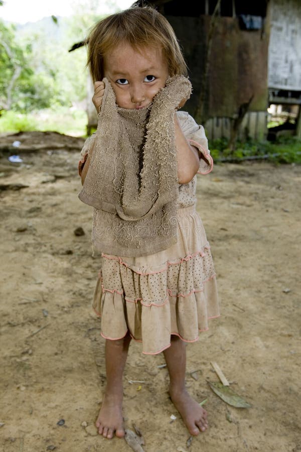 Hmong girl with a dirty cloth, Laos stock images