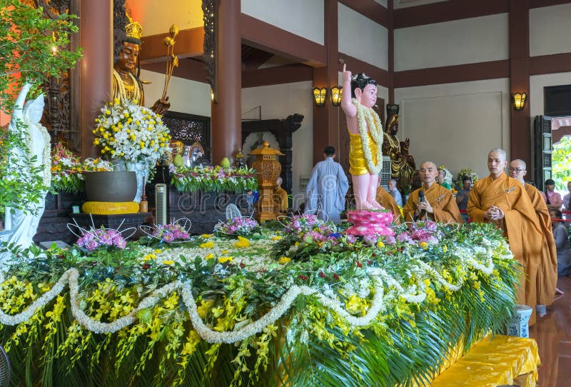 Ho Chi Minh City, Vietnam - May 10th, 2017: Buddhist statue in temple decorated lights, colorful flowers on Buddha`s birthday. A peacefull place to calm mine mind and soul in Ho Chi Minh city, Vietnam