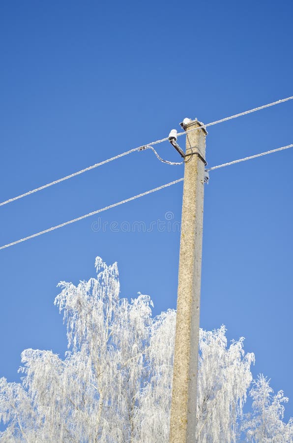 Hoarfrost in winter covered electicity pole and tree. Tree landcsape stock images, royalty-free photos and pictures