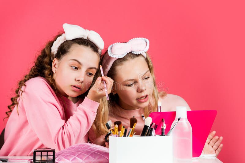 Hobby and fun. Cosmetics for children. Spa party. Sisterhood happiness. Skin care. Kids makeup. Beauty and fashion. Happy girls doing makeup. Beauty salon. Play with cosmetics. Cosmetics shop.