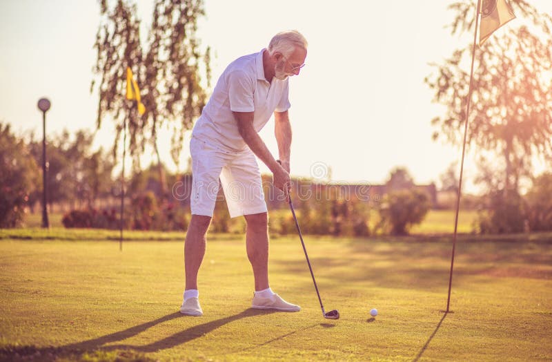 Senior man playing golf stock photo. Image of hobbies 222382050