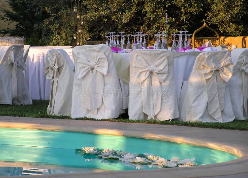 Wedding reception by the pool, closeup of catering setup. Wedding reception by the pool, closeup of catering setup