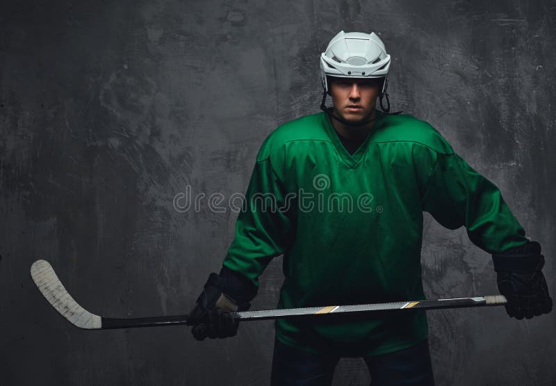 Hockey Player Wearing Green Protective Gear White Helmet Standing