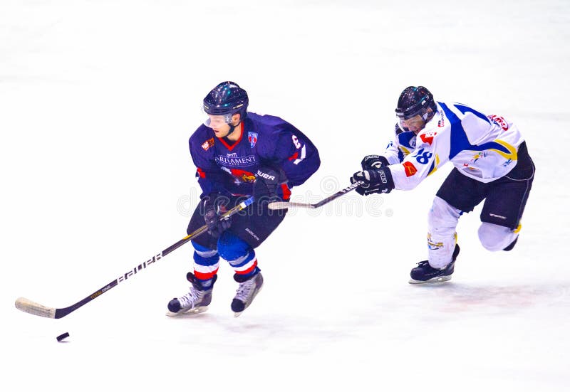 Hockey Players in Action with Puck Editorial Photo Image of play