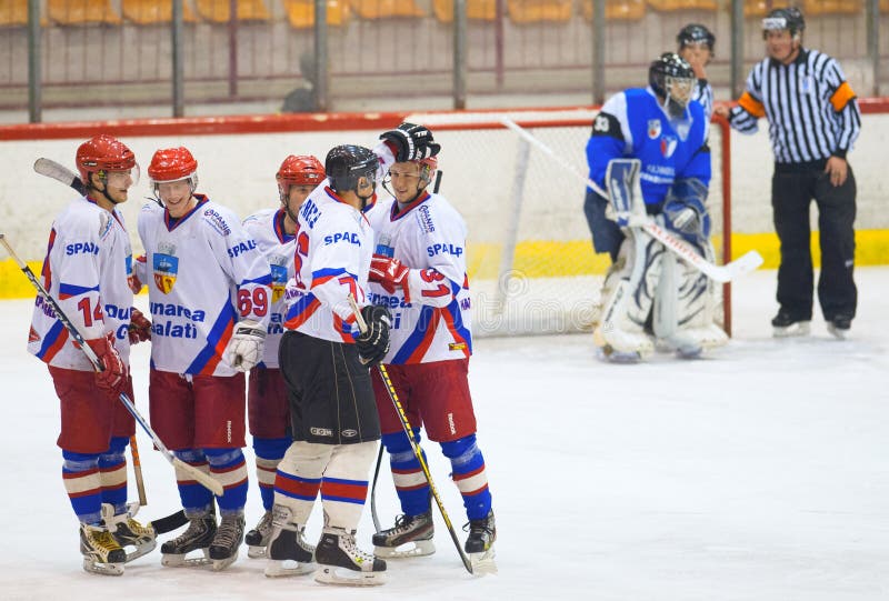 GALATI, ROMANIA - NOVEMBER 17: Unidentified players in action at hockey match with CSM Dunarea Galati (white) and CSS HSC Csikszereda (blue), Dovember 17, 2012 in Galati, Romania. GALATI, ROMANIA - NOVEMBER 17: Unidentified players in action at hockey match with CSM Dunarea Galati (white) and CSS HSC Csikszereda (blue), Dovember 17, 2012 in Galati, Romania