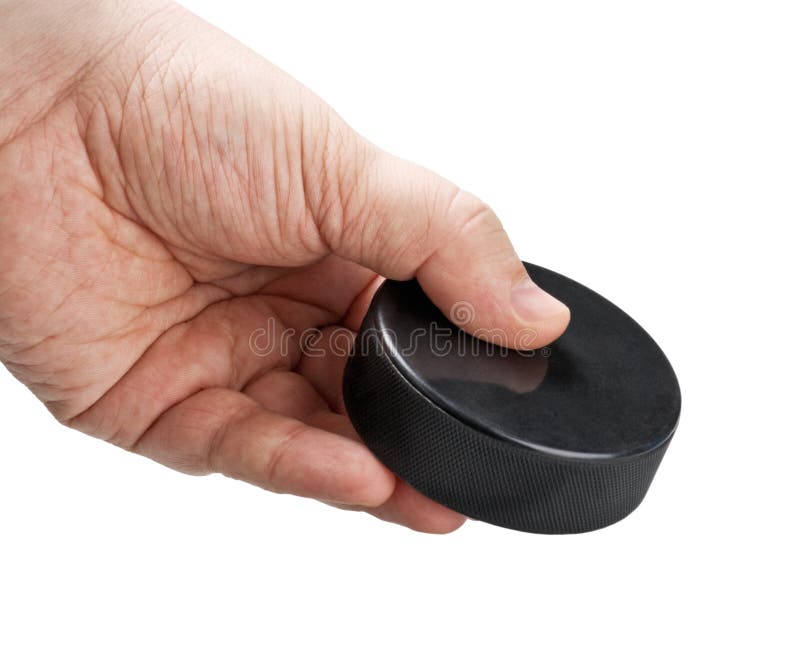 Hockey puck in his hand stock image. Image of fast, puck 27645043