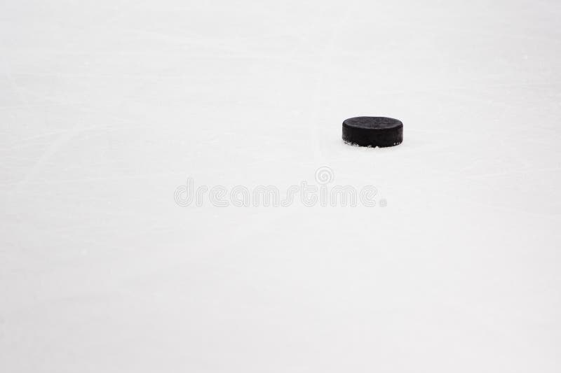 Hockey puck on ice stock photography Hockey puck on ice stock photography