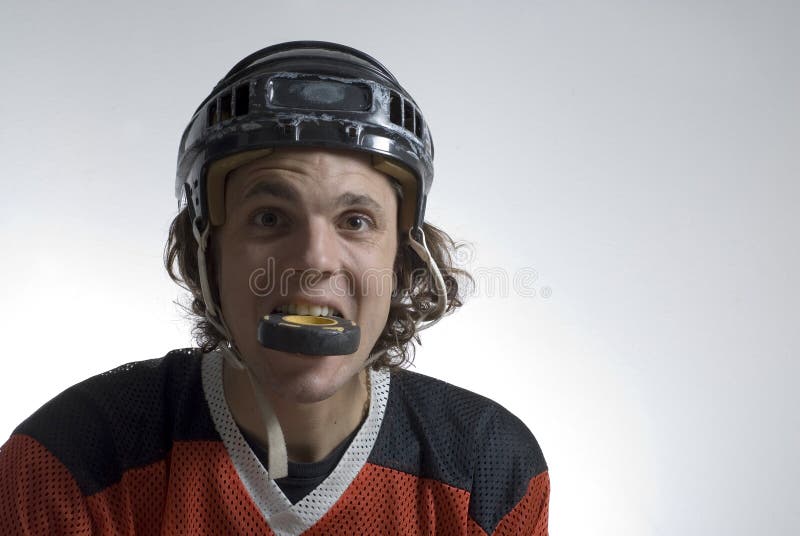 Hockey Puck in Mouth - Horizontal