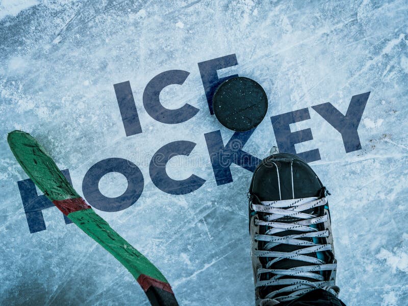 Hockey Puck and Stick on the Ice Texture, Copyspace and Text B Stock