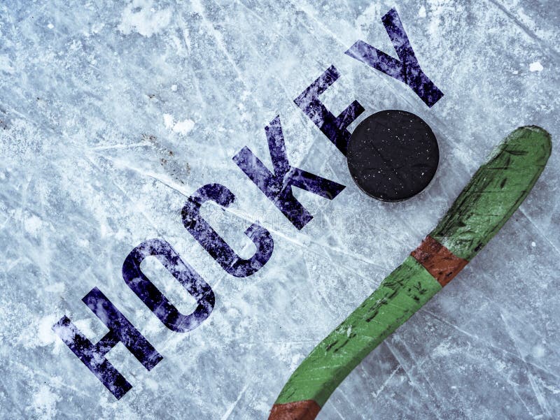 Hockey Puck and Stick on the Ice Texture, Copyspace and Text B Stock