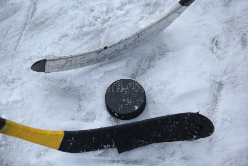 Hockey Sticks and Puck stock image. Image of game, throw 65259901