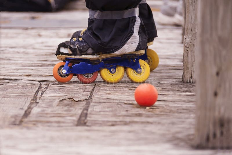 Hocky Players Skates while he is Standing Befine the Bench Stock Photo