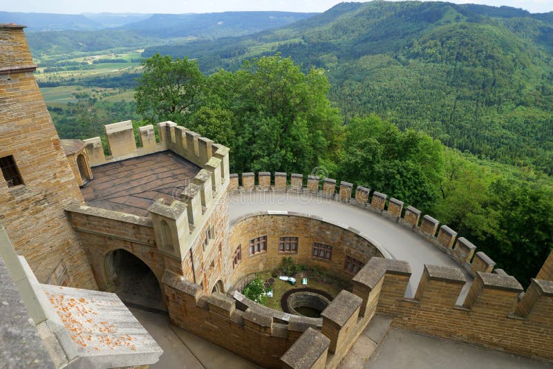 Hohenzollern Castle is approximately 50 kilometers (31 miles) south of Stuttgart, Germany. It is considered the ancestral seat of the Hohenzollern family, which emerged in the Middle Ages and eventually became German Emperors. The castle was first constructed in the early 11th century and completely destroyed after a 10-month siege in 1423 by the imperial cities of Swabia. A second, larger and more sturdy castle was constructed from 1454 to 1461, and served as a refuge for the Catholic Swabian Hohenzollerns during wartime; including during the Thirty Years' War. By the end of the 18th century, however, the castle gradually fell into disrepair, leading to the demolition of several dilapidated buildings. Today, only the chapel remains from the medieval castle. The third version of the castle, which stands today, was constructed for King Frederick William IV of Prussia between 1846 and 1867. The design is based on English Gothic Revival architecture and the castles of the Loire Valley. Hohenzollern Castle is approximately 50 kilometers (31 miles) south of Stuttgart, Germany. It is considered the ancestral seat of the Hohenzollern family, which emerged in the Middle Ages and eventually became German Emperors. The castle was first constructed in the early 11th century and completely destroyed after a 10-month siege in 1423 by the imperial cities of Swabia. A second, larger and more sturdy castle was constructed from 1454 to 1461, and served as a refuge for the Catholic Swabian Hohenzollerns during wartime; including during the Thirty Years' War. By the end of the 18th century, however, the castle gradually fell into disrepair, leading to the demolition of several dilapidated buildings. Today, only the chapel remains from the medieval castle. The third version of the castle, which stands today, was constructed for King Frederick William IV of Prussia between 1846 and 1867. The design is based on English Gothic Revival architecture and the castles of the Loire Valley.