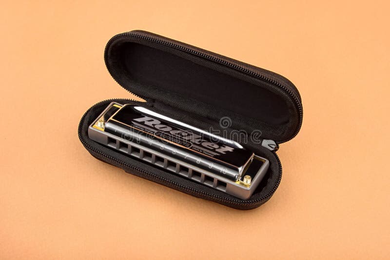 Hohner Professional Diatonic Rocket Harmonica Lies in an Open Black