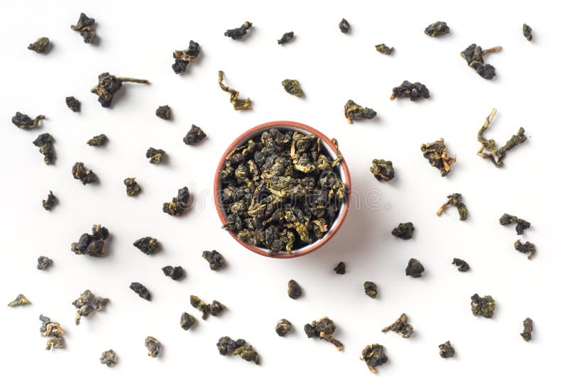 Hojas secas de Taiwán del té fresco del oolong en taza fotos de archivo libres de regalías Hojas secas de Taiwán del té fresco del oolong en taza fotos de archivo libres de regalías