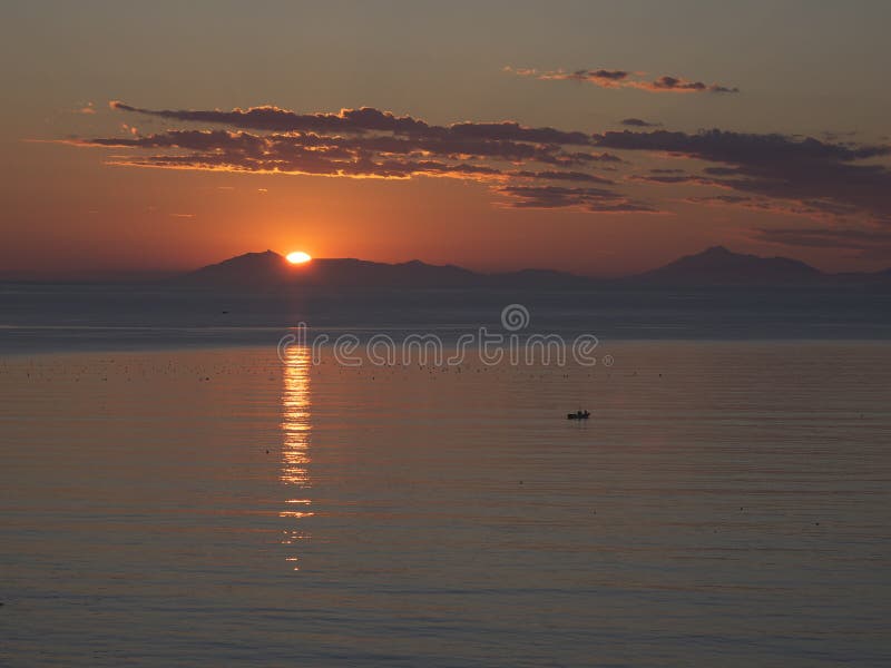 Kunashiri island and the rising sun viewed from Rausu,Nemuro strait, Hokkaido, Japan