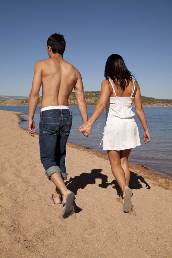 Hold hands walk beach