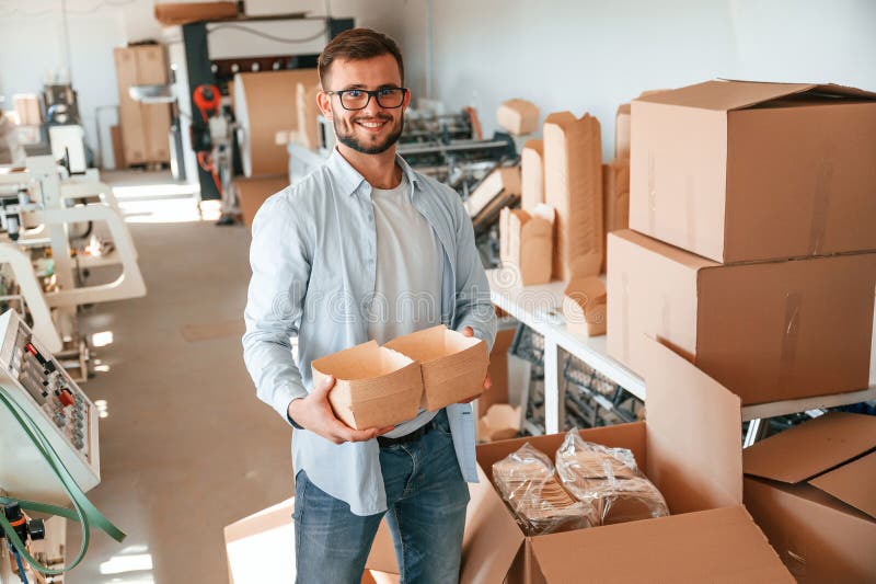 Holding Beautiful Wooden Packages. Print House Worker in White Clothes ...