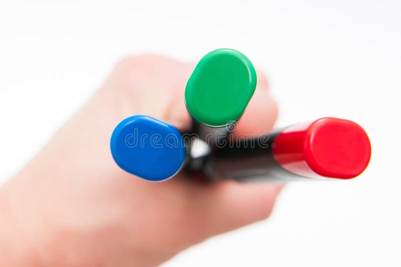 Holding colored markers royalty free stock images