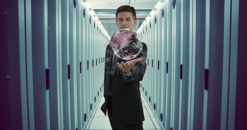 Holding digital globe, businessman in data center visualizing global network connections stock photography