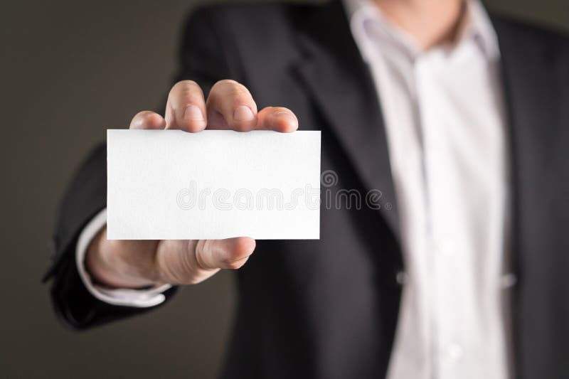 Holding empty white business card. royalty free stock images