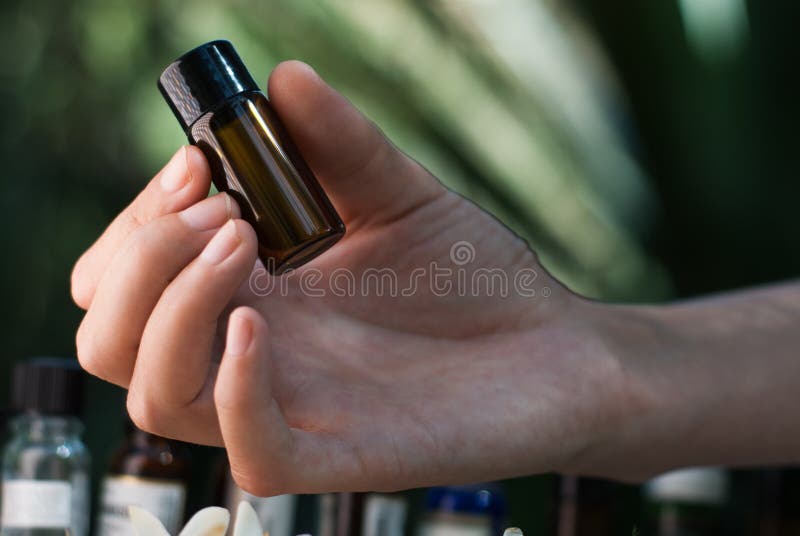 Holding essential oil bottle royalty free stock images Holding essential oil bottle royalty free stock images