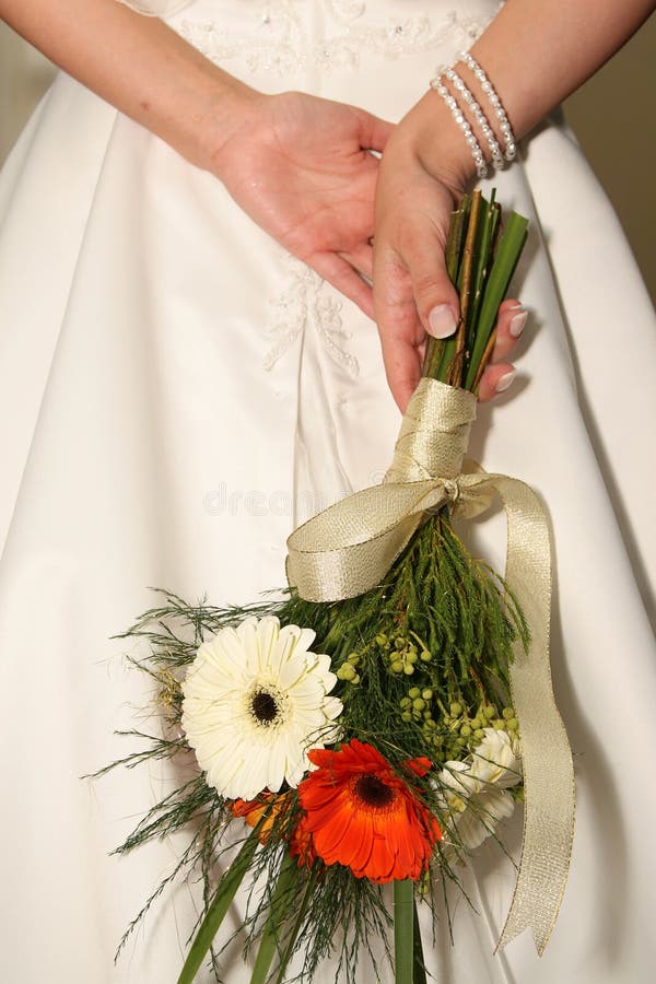 Holding Flowers stock image. Image of gown, yellow, bouquet 3921949