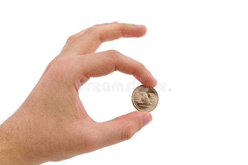 Holding för hand för myntfingerguld arkivbild