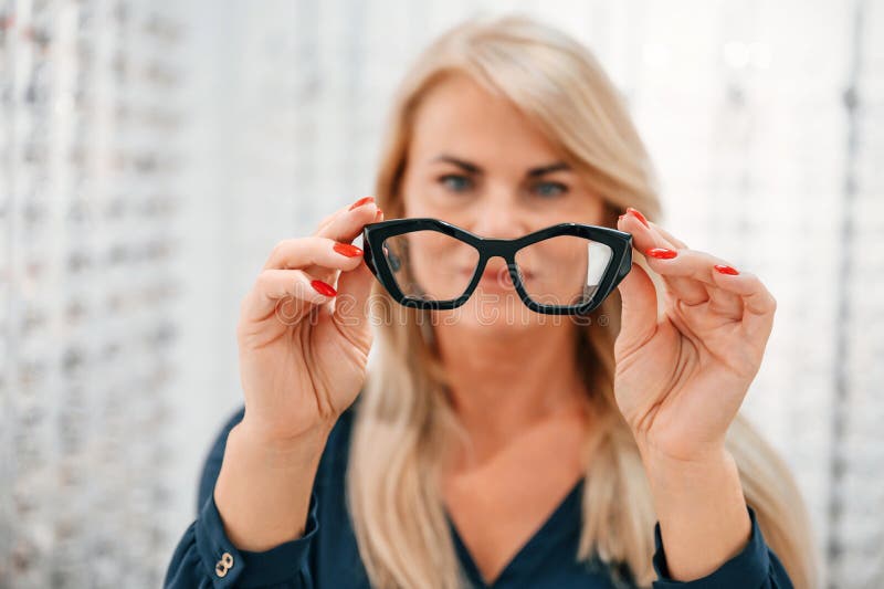 Holding Glasses in Hands. Woman is in the Store Stock Image Image of equipment, european