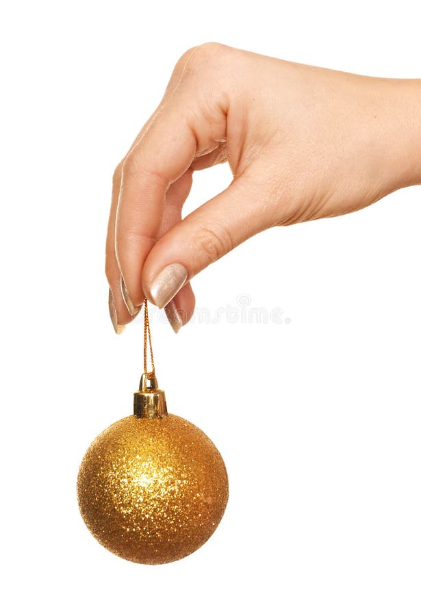 Holding gold Christmas ball