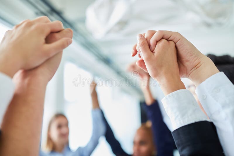 Holding hands for motivation and team building royalty free stock images