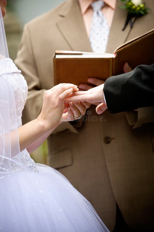 Holding hands during a wedding ceremony