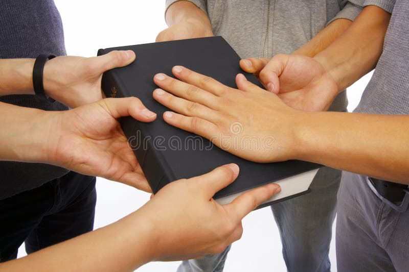 Group of people holding Holy Bible to unity, promises and prayer. Group of people holding Holy Bible to unity, promises and prayer