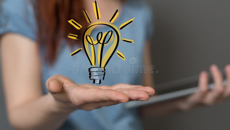A  holding illuminated light bulb, idea, innovation and inspiration concept