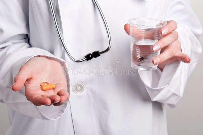 Holding Pills royalty free stock photos