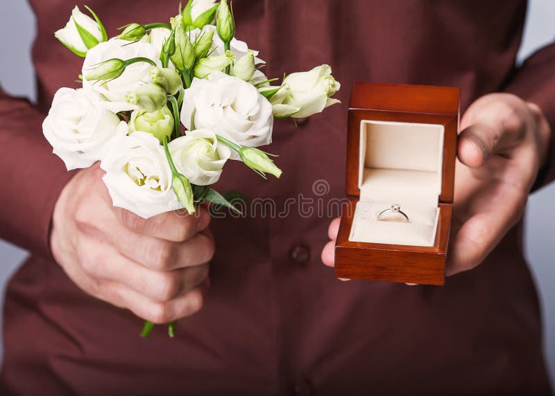 Holding Ring Box and a Bouquet of Flowers Stock Photo Image of love