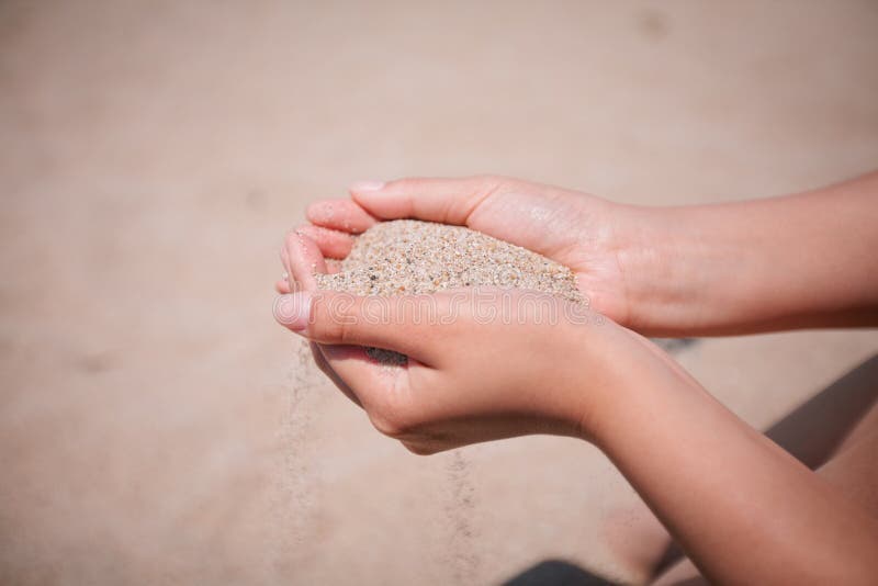 Boy Holding Sand at Beach stock image. Image of hair 50113187
