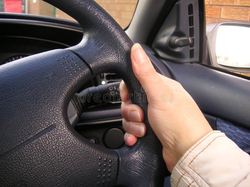 Holding a steering wheel