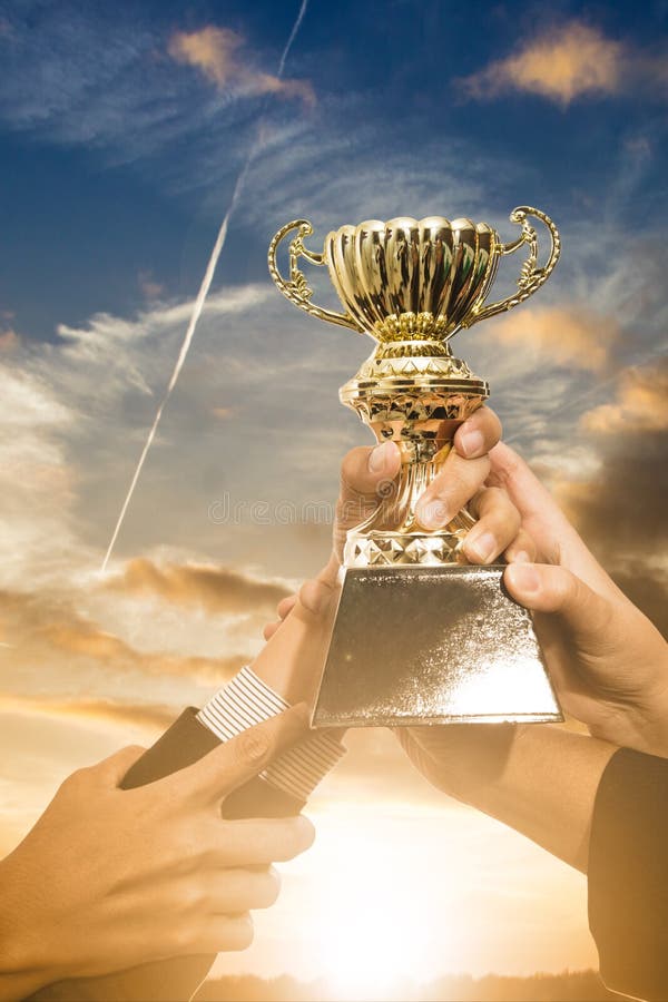 Holding Trophy awards stock photo. Image of holding, champ 65961348