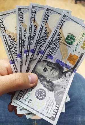 Holds Dollars In His Hand 500 Dollars In Hand Dollar Bills In Hand 