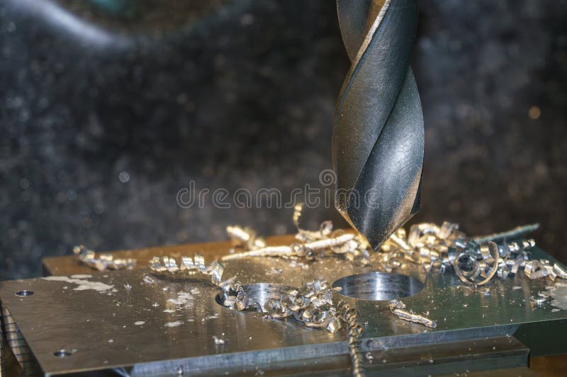 Hole Making Process on Metal Plate by Drill Tool on NC Milling Machine royalty free stock images